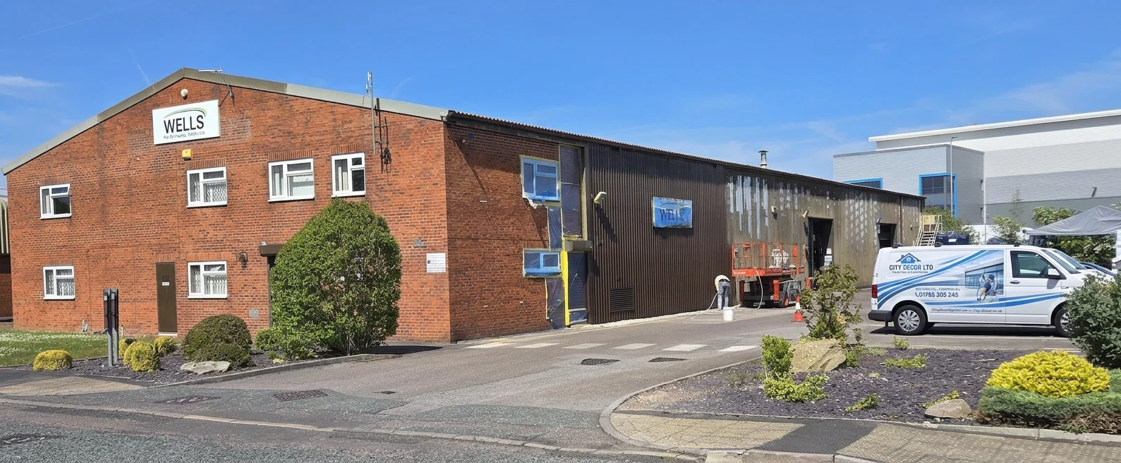 Wells Performance Materials factory — cladding respray in progress by City Decor Ltd